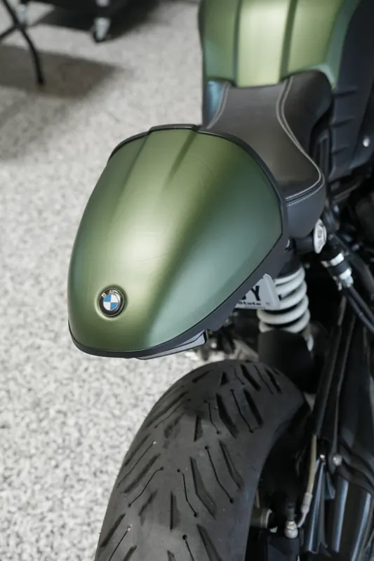 Matte green BMW motorcycle tail cowl close-up