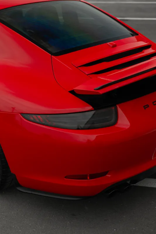Red Porsche 911 rear deck and smoked taillight detail